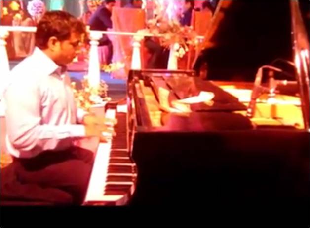 male piano player pune